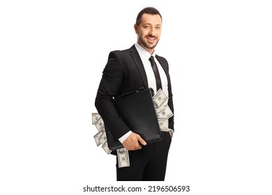 Happy businessman holding a briefcase full of money isolated on white background