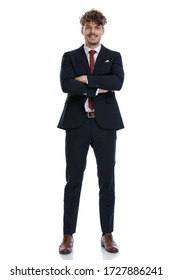 Happy Businessman Laughing With His Arms Crossed While Wearing Suit And Standing On White Studio Background