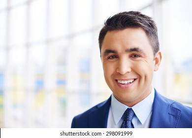 Happy Businessman Looking At Camera With Smile