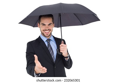 Happy businessman under umbrella offering handshake on white background - Powered by Shutterstock