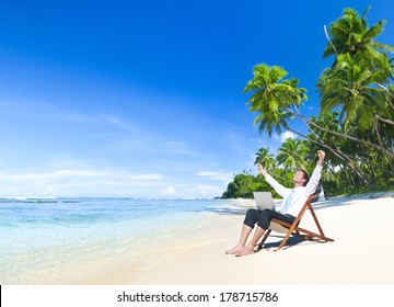 Happy Businessman Working on a Tropical Beach  - Powered by Shutterstock