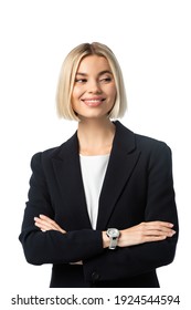 happy businesswoman with crossed arms smiling while looking away isolated on white