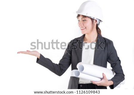 Happy  businesswoman engineer presenting something on right her hand isolated on white. Architect worker with white protect helmet wearing.