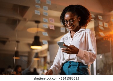 Happy businesswoman in office. Portrait of beautiful businesswoman using the phone. - Powered by Shutterstock