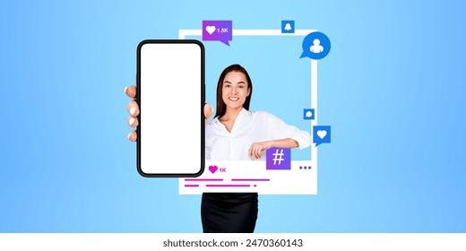 Happy businesswoman showing mock up smartphone, photo posted on social media feed, comments and likes. Concept of mobile app, website, social media and business communication - Powered by Shutterstock