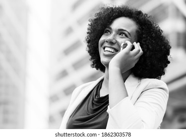 Happy Businesswoman Talking On The Phone