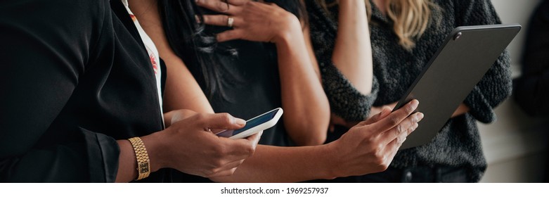 Happy businesswomen using digital devices - Powered by Shutterstock