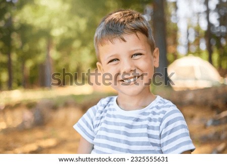 Happy, camping and portrait of child in park smile for playing, adventure and freedom in nature. Childhood, happiness and face of little boy in woods or forest for hiking, traveling and trekking
