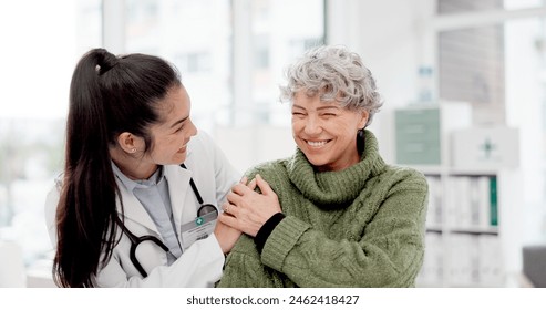 Happy, care and face of a doctor with a woman for medical trust, healthcare and help. Laughing, hug and portrait of a young nurse with a senior patient and love during a consultation at a clinic - Powered by Shutterstock