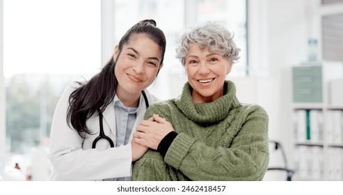 Happy, care and face of a doctor with a woman for medical trust, healthcare and help. Laughing, hug and portrait of a young nurse with a senior patient and love during a consultation at a clinic - Powered by Shutterstock