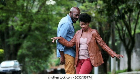 Happy Carefree Black Couple Dancing Together Outside In Street