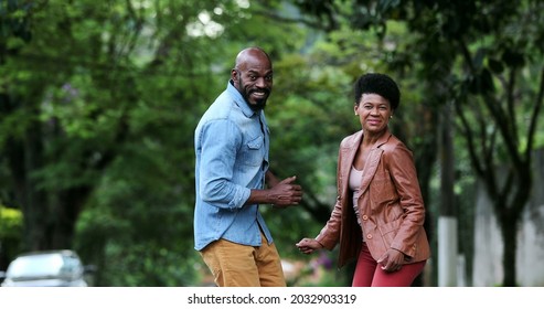 Happy Carefree Black Couple Dancing Together Outside In Street