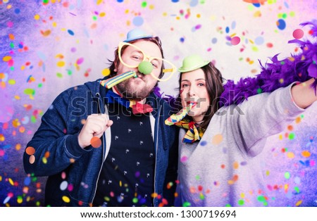 Similar – Image, Stock Photo Young happy couple enjoying a birthday party