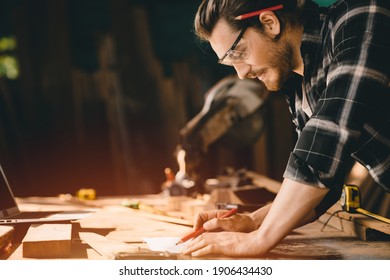 Happy Carpenter Smiling To Sketch Design Wooden Furniture In Wood Workshop Professional Look High Skill Real Authentic Handcrafted Working People.