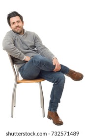 Happy Casual Man On A Chair, Isolated On White Background