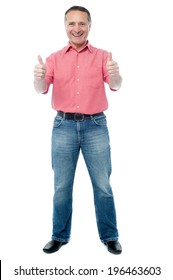 Happy casual man showing double thumbs up