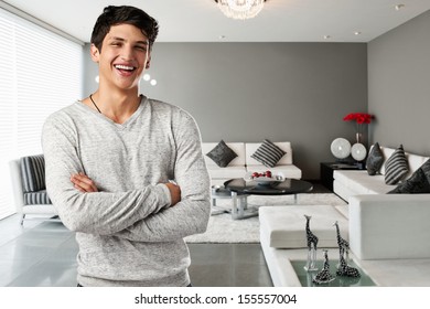 Happy Casual Young Man At Modern Apartment