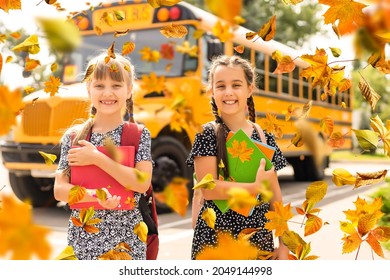 Happy Caucasian Children Elementary Student Running By Yellow Bus On First September Day. Education And Back To School In Autumn Fall. Excited Child Kid On Schoolyard Outdoors. Web Banner Header.