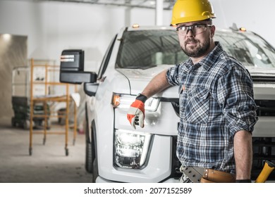 Happy Caucasian Construction Contractor In His 30s In Front Of His Brand New Modern Pickup Truck. Construction Site.