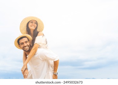 Happy Caucasian couple enjoy and fun outdoor lifestyle travel nature at the sea on summer beach holiday vacation. Man and woman walking and playing together at tropical island beach at sunset.  - Powered by Shutterstock