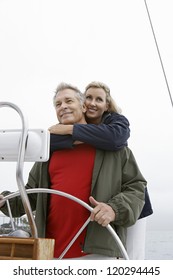 Happy Caucasian Couple On Sail Boat During Vacation