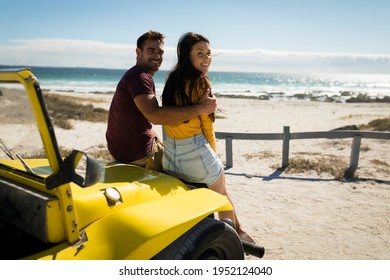 Happy caucasian couple sitting in beach buggy looking to camera. beach break on summer holiday road trip. - Powered by Shutterstock