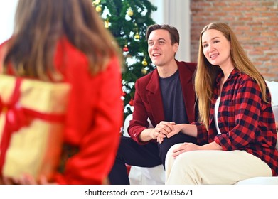 Happy Caucasian Family Parent, Father And Mother Are Celebrating And Giving Present Box For Lovely Daughter In Birthday And Chrismas Day