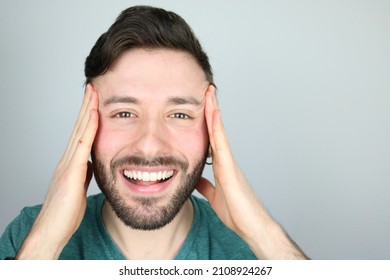 Happy Caucasian Man Doing Facial Yoga Exercise 