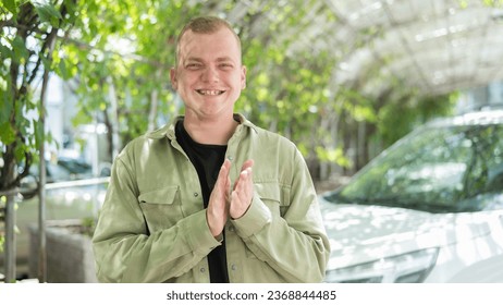 Happy caucasian man with hearing aids outdoors. - Shutterstock ID 2368844485