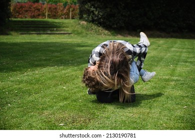 Happy Caucasian Mother And Daughter Playing Hugging In The Garden At Home. Family, Daily Life, Mother's Day