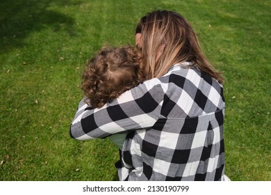 Happy Caucasian Mother And Daughter Playing Hugging In The Garden At Home. Family, Daily Life, Mother's Day