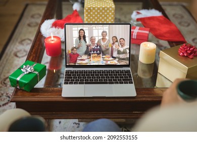 Happy Caucasian Multi Generation Family Smiling On Laptop Video Call Screen At Christmas Time. Christmas, Festivity And Communication Technology.