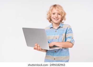 Happy caucasian smart little small preteen boy male child kid elementary primary middle school pupil teenager in casual using holding laptop netbook computer isolated over white background - Powered by Shutterstock