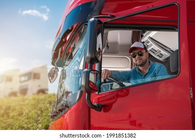 Happy Caucasian Truck Driver In His 30s Preparing Himself For Another International Haul. Heavy Duty Transportation Trucker.