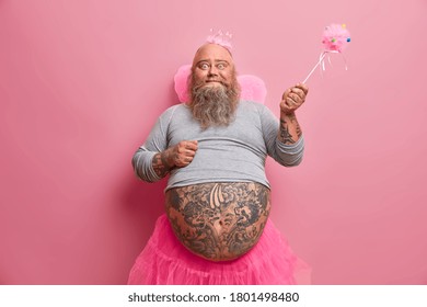 Happy Celebration, Fantasy, Family Fun Party Concept. Positive Friedly Looking Plump Man Comes From World Of Fairies, Makes Your Dreams Come True, Has Different Activities With Children On Child Show