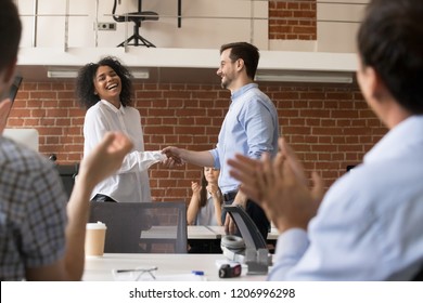 Happy Ceo And Team Congratulating Successful African American Worker By Shaking Clapping Hands, Smiling Black Employee Excited By Reward Bonus Promotion, Handshake As Gratitude Recognition Concept