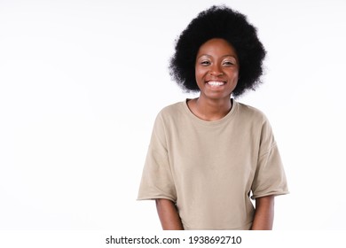 Happy cheerful african girl laughing isolated over white background - Shutterstock ID 1938692710