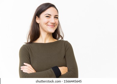 Happy Cheerful Female Customer Posing For Camera With Arms Crossed. Young Woman In Casual Standing Isolated Over White Background. Happy Woman Concept