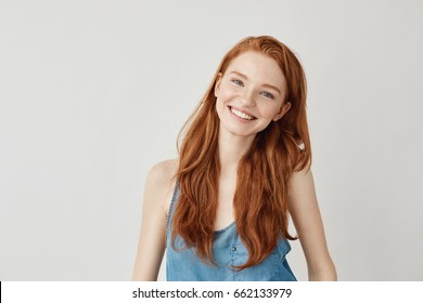 Happy Cheerful Ginger Girl Smiling Looking At Camera.