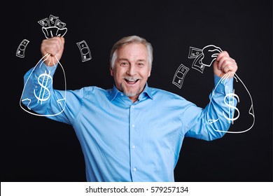Happy Cheerful Man Holding Bags With Money