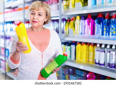 Happy Cheerful Positive Smiling Woman Consumer With Household Chemical Products For Washing Indoors