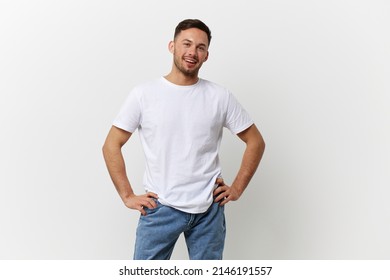 Happy cheerful tanned handsome man in basic t-shirt smile at camera posing isolated on over white studio background. Copy space Banner Mockup. People emotions Lifestyle concept. Model snapshots - Shutterstock ID 2146191557