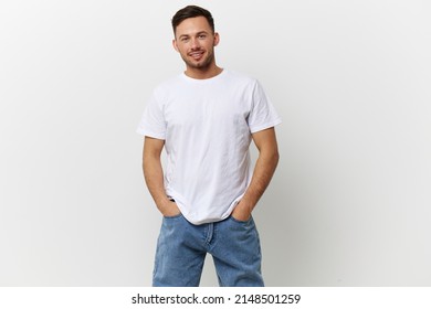 Happy cheerful tanned handsome man in basic t-shirt smile at camera posing isolated on over white studio background. Copy space Banner Mockup. People emotions Lifestyle concept. Model snapshots - Shutterstock ID 2148501259