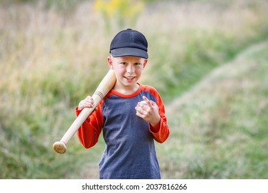 Happy Child With Baseball Bat On Nature Concept In Park