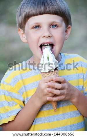 Similar – Image, Stock Photo Lovely boy eating an ice cream on the beach