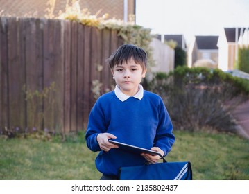 Happy Child Boy Holding Tablet Pc Standing Outside Waiting For School Bus, Portrait Kid Playing Game Online Or Reading Strory On Internet, Preschool Boy Learning With Modern Technology