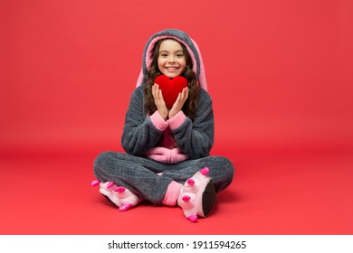 Happy Child In Bunny Pajamas Hold Red Heart Lifesaving Gift, Donation.