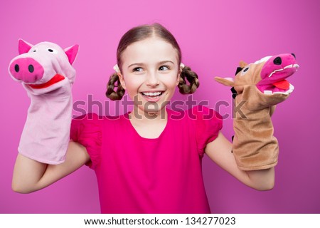 Happy child, creative fun concept - girl playing in the theater