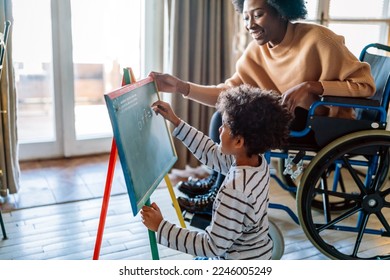 Happy child doing math exercises with her mother ot teacher together. Education people fun concept - Powered by Shutterstock