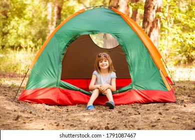 happy child girl enjoy summer time in camping tent in summer forest. Active childhood - Powered by Shutterstock